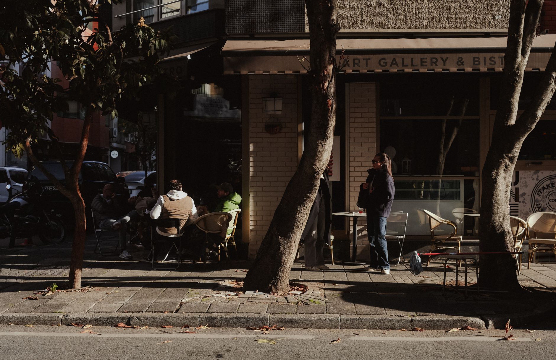 A scenic view of historic buildings and green trees in downtown Turner, Oregon, during a soft autumn afternoon.