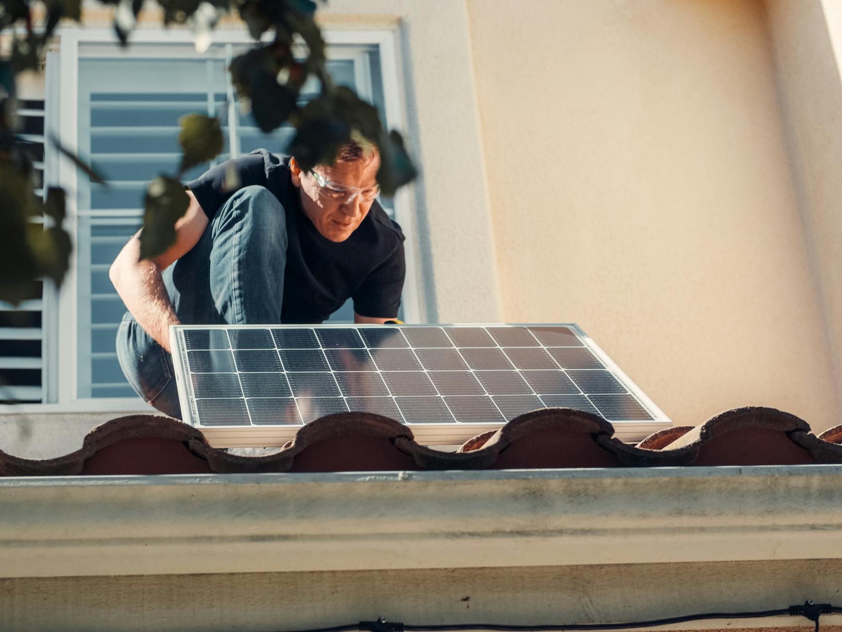 A professional roofing technician conducting a detailed roof inspection on a home in Jefferson, Oregon.